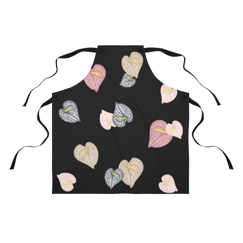 Black tie kitchen apron with pink, gray and tan anthurium flower all over print design.