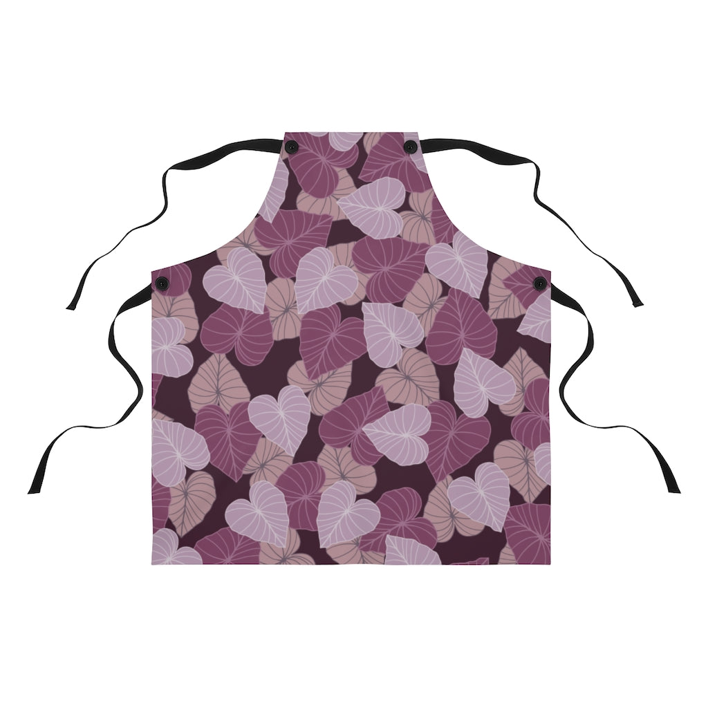 Chef apron with all over print design in varying pink and mauve Kalo leaves on a maroon background.