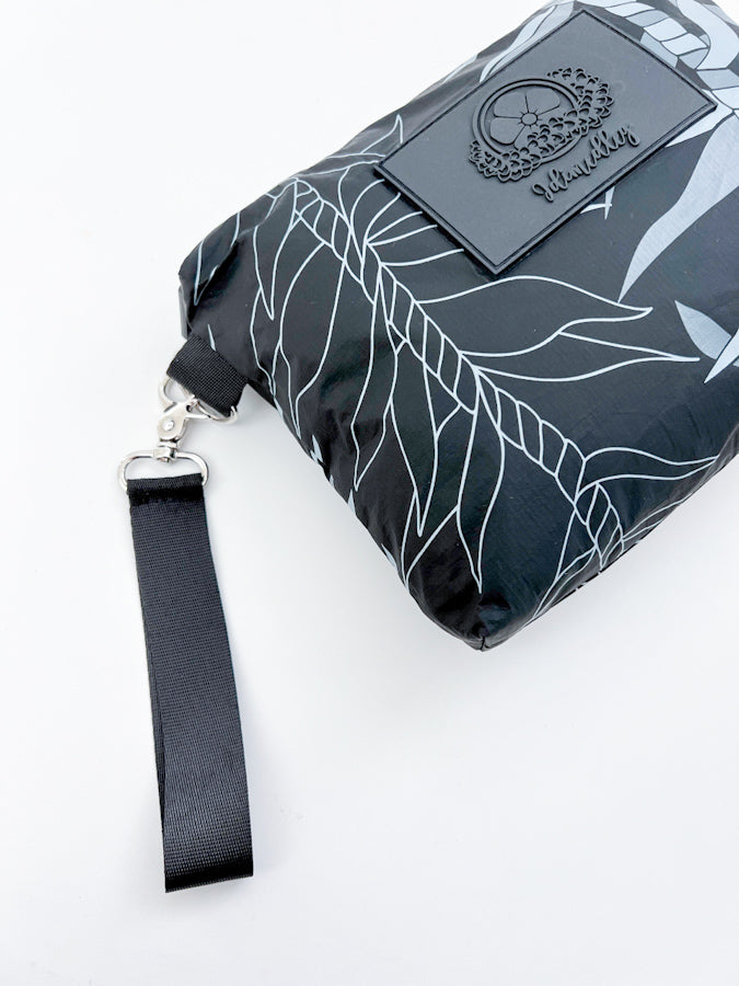 Ti leaf lei accessory pouch close up of detachable wristlet