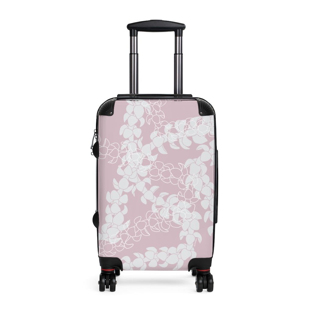 Rolling, hard shell carryon luggage with pink and white Puakenikeni flower lei design. 