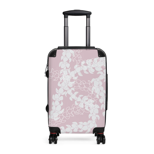 Rolling, hard shell carryon luggage with pink and white Puakenikeni flower lei design. 