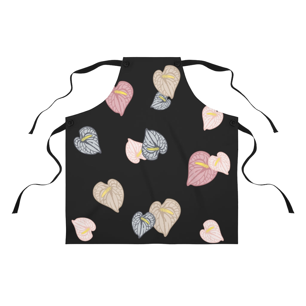 Black tie kitchen apron with pink, gray and tan anthurium flower all over print design. 